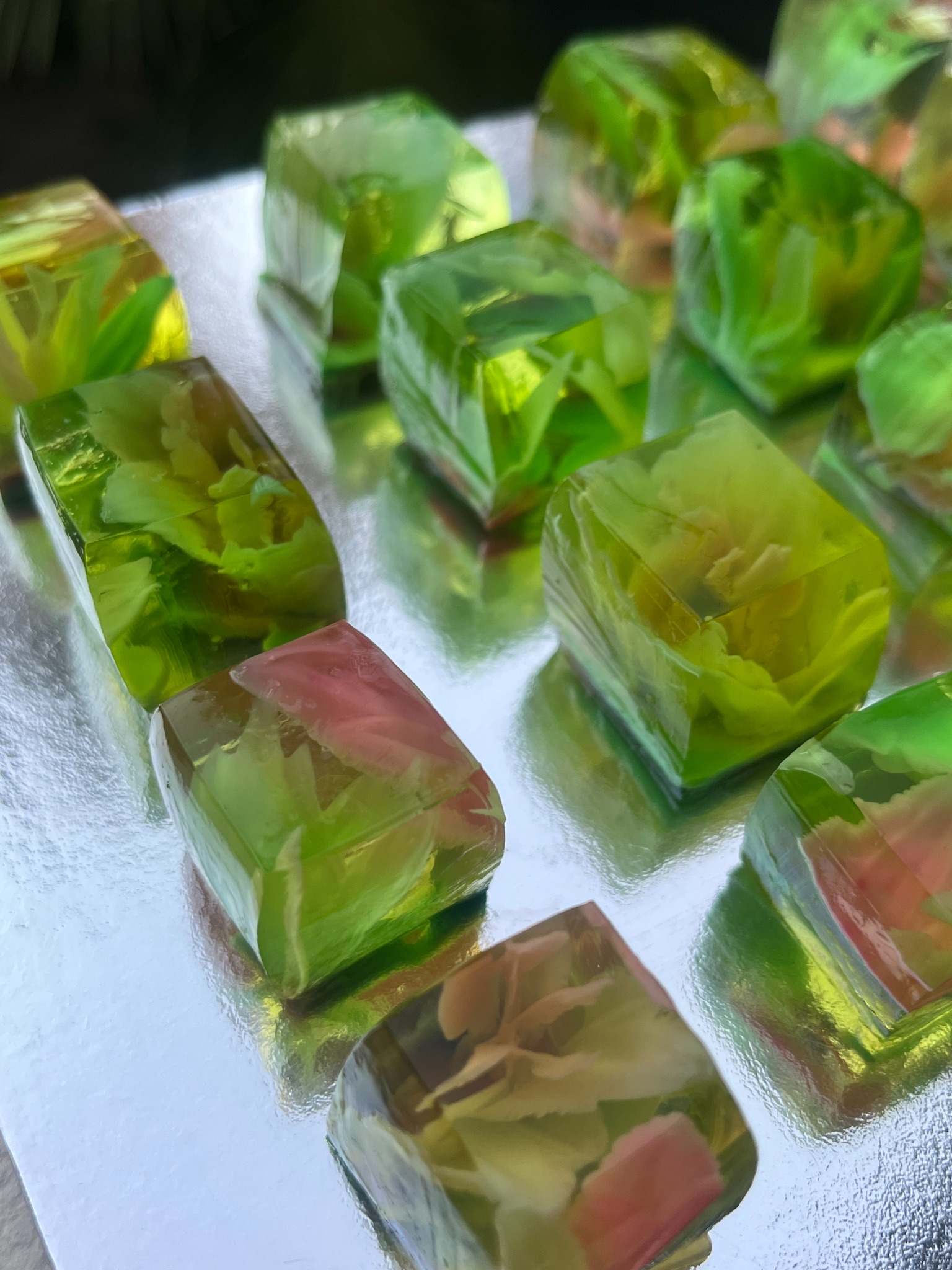 Close-up of translucent green Wobble Bites with floral details